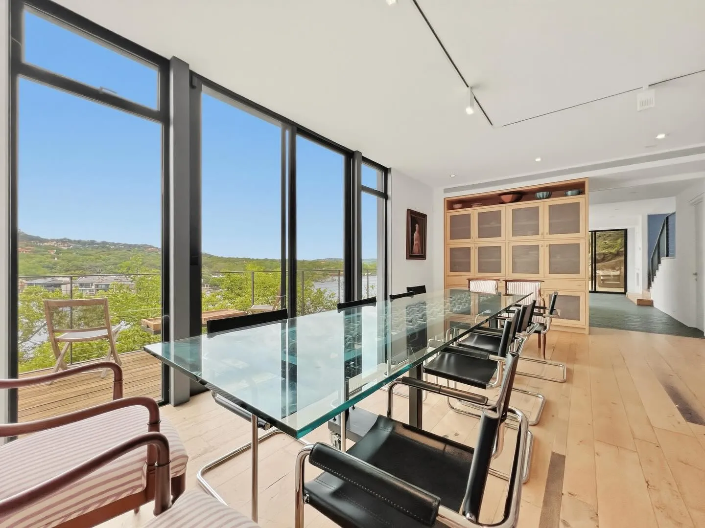 Glass-walled dining room overlooking the hills
